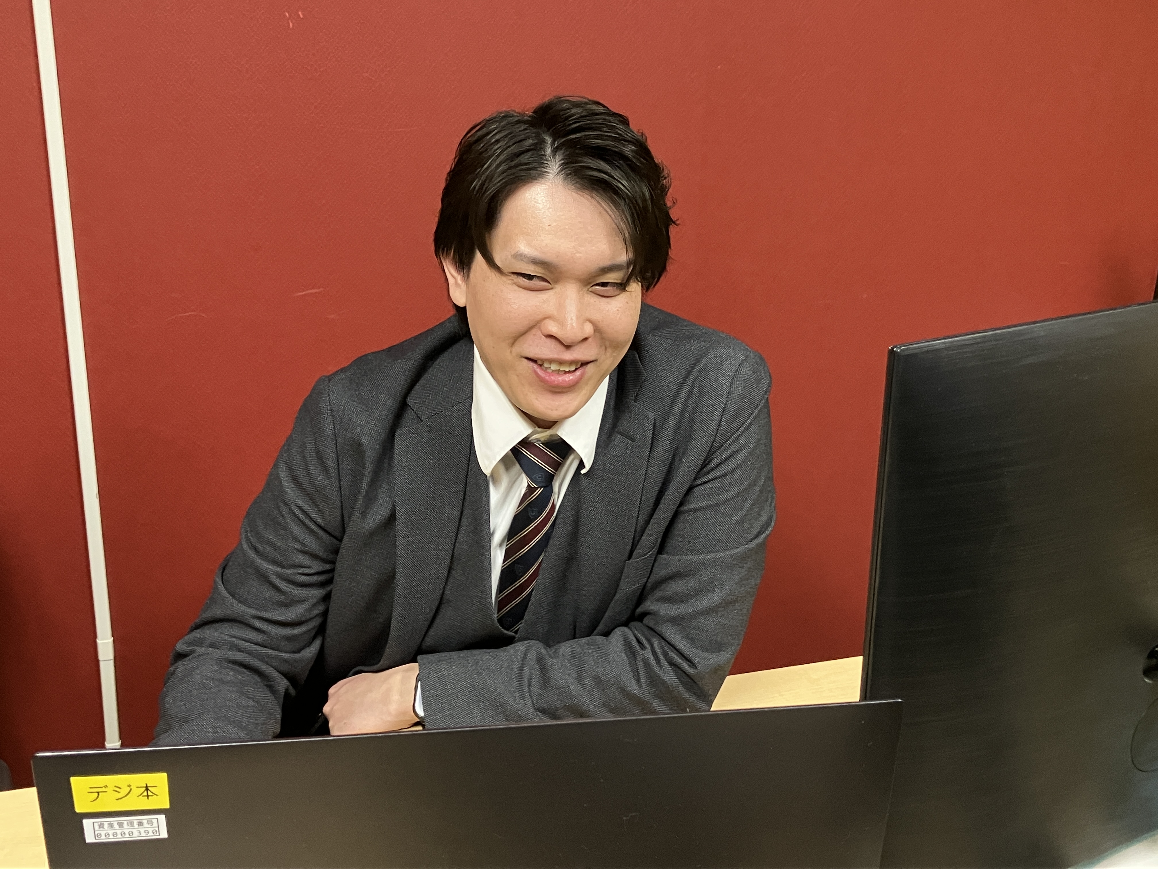 システム開発部 課長／鮎川飛雅